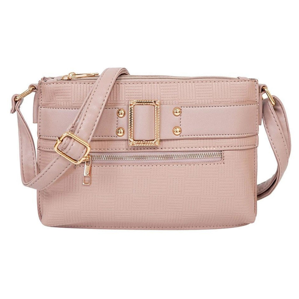 Front view of dusty mauve-pink faux leather crossbody bag with embossed geometric texture, decorative gold-tone buckle, stud accents, front zipper pocket, and adjustable strap on white