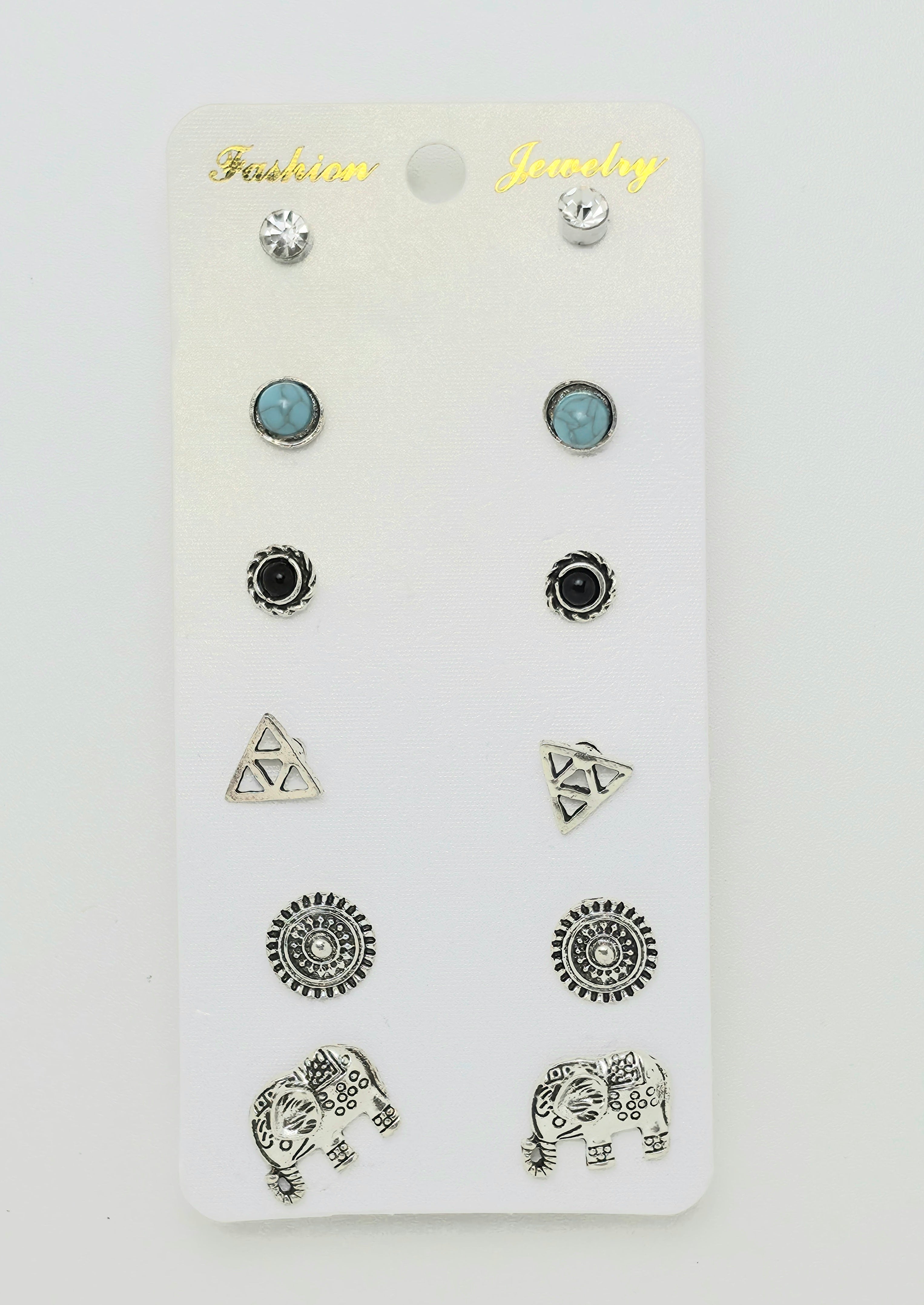 A set of 12 stud earrings displayed on a white card labeled 'Fashion Jewelry'. The earrings include silver geometric, elephant, and circular designs, as well as two light blue oval studs.