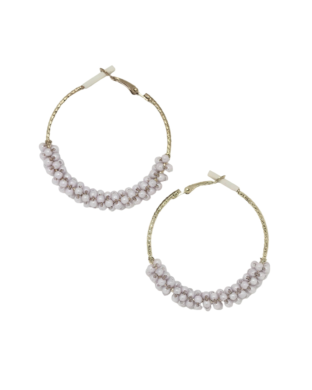 Pair of gold-tone textured hoop earrings with chunky lavender pink crystal beads wire-wrapped along the bottom half, hinged click-top closure, isolated on white background