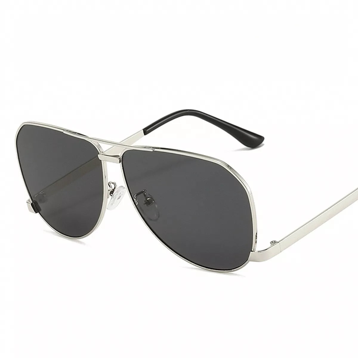 Silver-tone metal aviator sunglasses with dark gray teardrop lenses, a double bridge, clear nose pads, and black temple tips on a white background