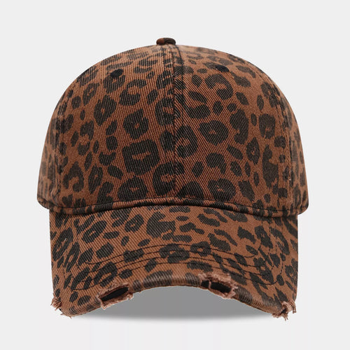 Front view of a brown cotton baseball cap with black leopard print, a covered top button, and a distressed curved brim