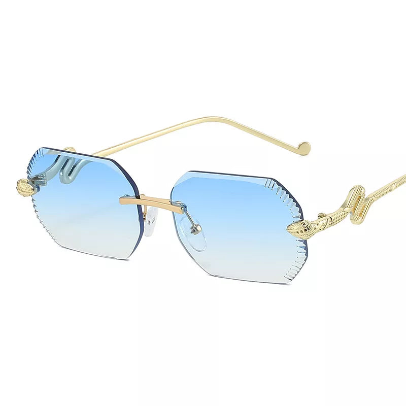 Pale blue gradient rimless sunglasses with gold-tone snake temples, a slim bridge, and clear nose pads on a white background