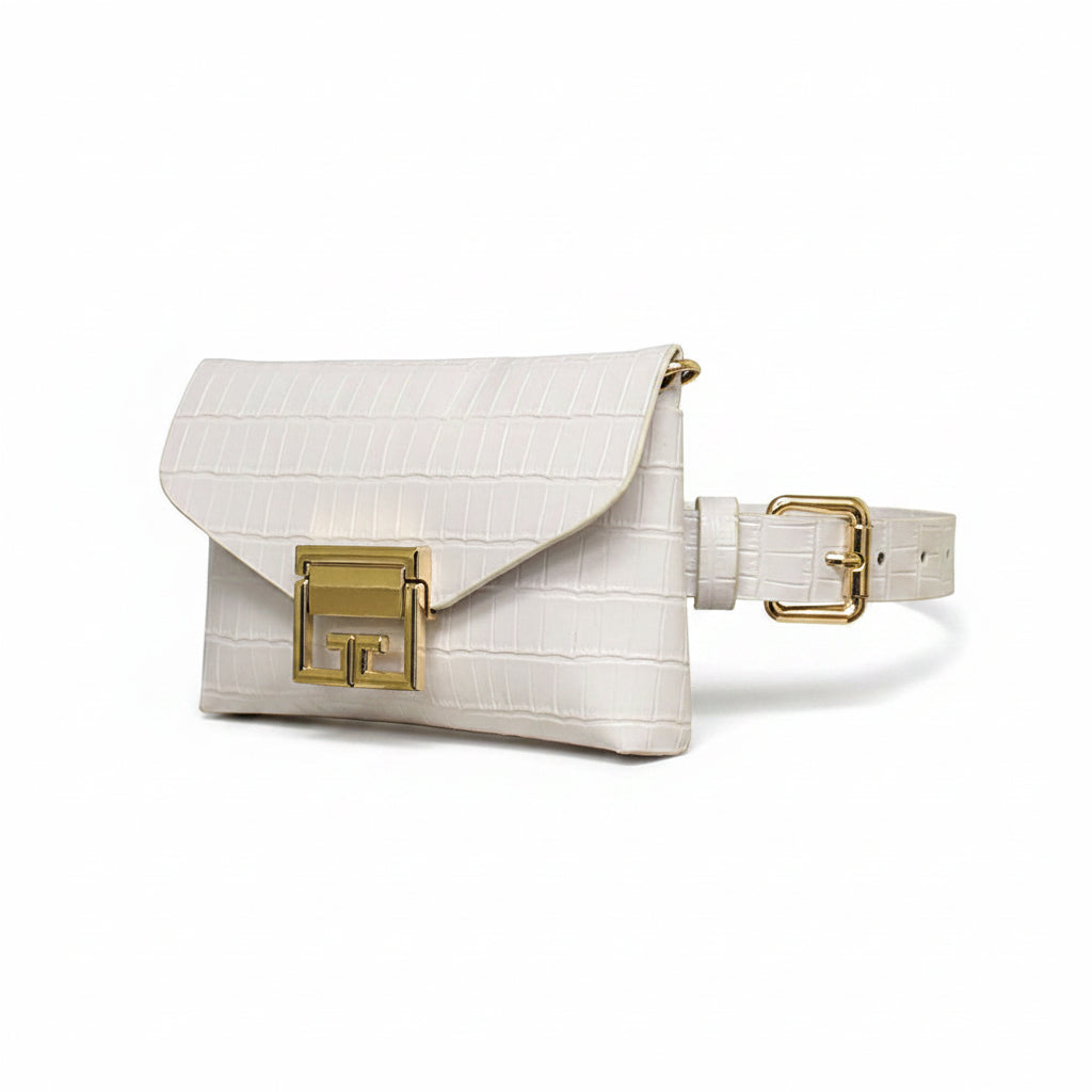 White alligator-embossed faux leather fanny pack with envelope flap, gold square turn-lock closure, and white adjustable belt strap with gold square buckle, angled view showing side profile, white background