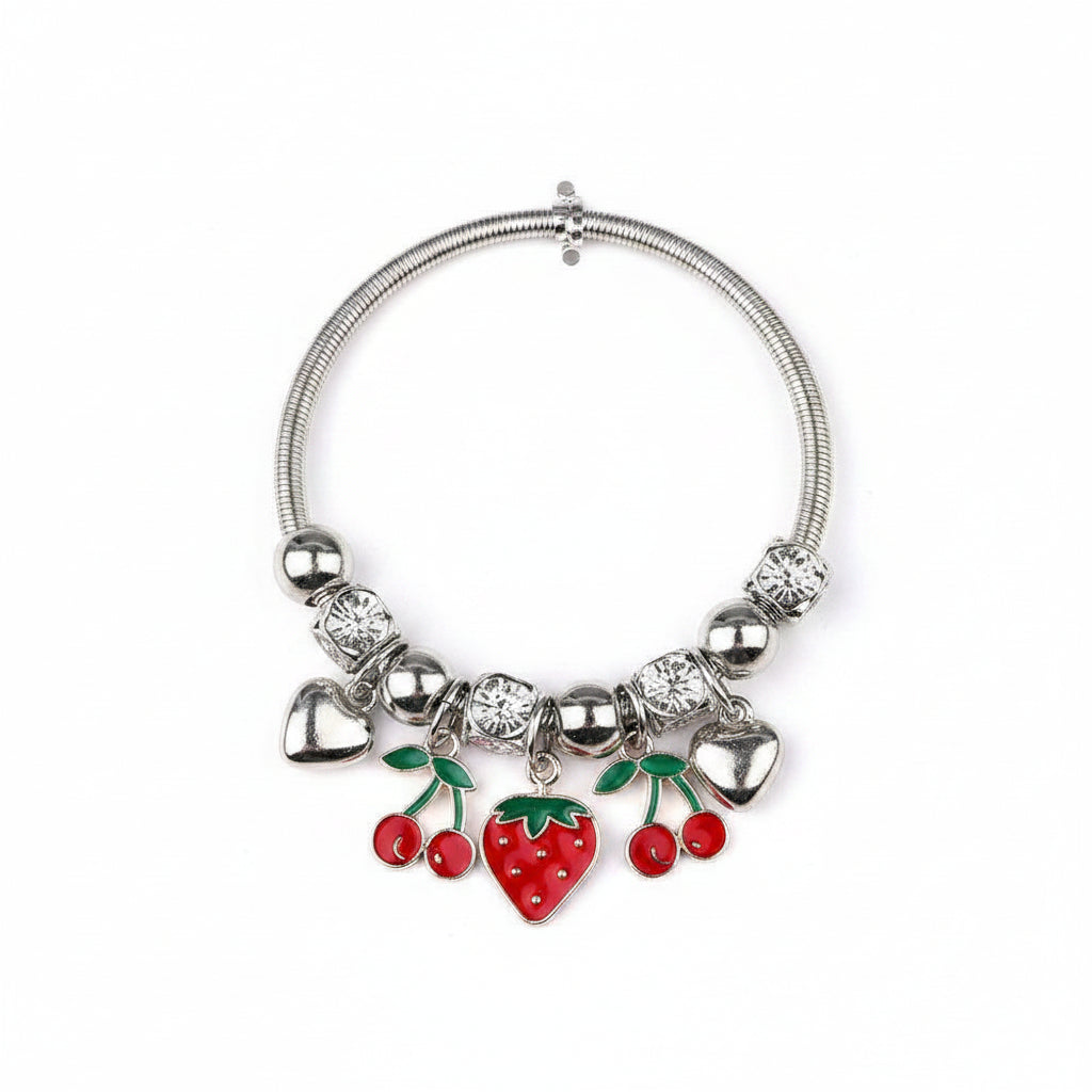 Silver-tone snake chain stretch bracelet with engraved bead and silver ball spacers, featuring dangling red enamel cherry charms with green leaves, red enamel strawberry heart charm, and silver heart charms, white background