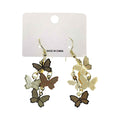 Butterfly metal plate layered drop earrings in gold-tone on white retail card — cascading cluster of three textured metal butterfly charms in dark brown, medium brown, and cream with gold chain links and gold fish hook backs, white background