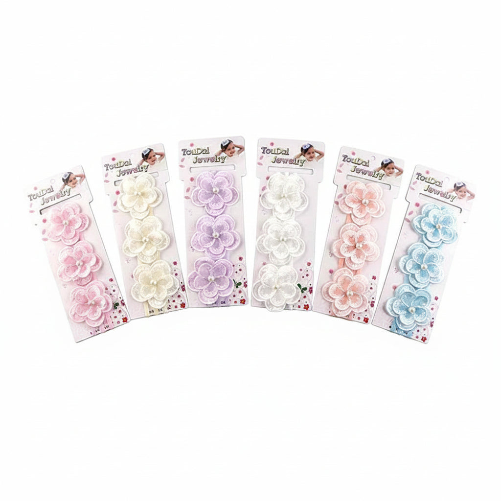 Six kids floral lace stretch headbands fanned out on retail cards — pink, cream, lavender, white, peach, and light blue — each featuring three layered lace flower appliqués with pearl bead centers on an elastic stretch band, white background