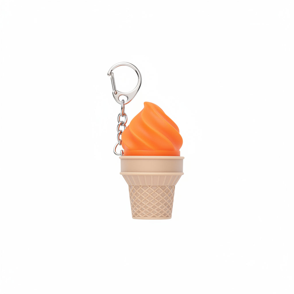 Orange soft-serve swirl plastic ice cream cone fidget clicker keychain with tan waffle cone base, silver chain, and silver carabiner-style clip, white background