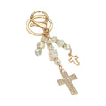 Double rhinestone cross charm drop bag charm keychain with iridescent AB crystal faceted beads, gold-tone open cross pendant and gold-tone pavé rhinestone cross pendant, gold lobster clasp and key ring, white background