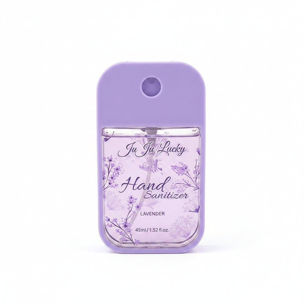 Ju Ju Lucky pocket hand sanitizer spray 45ml in lavender purple silicone case with clear lower section decorated with purple lavender botanical floral print, label reads Ju Ju Lucky Hand Sanitizer Lavender 45ml/1.52fl.oz, white background