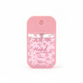 Ju Ju Lucky pocket hand sanitizer spray 45ml in light pink silicone case with pink cherry blossom floral print label reading Ju Ju Lucky Hand Sanitizer Camellia 45ml/1.52fl.oz, circular spray nozzle on top, white background