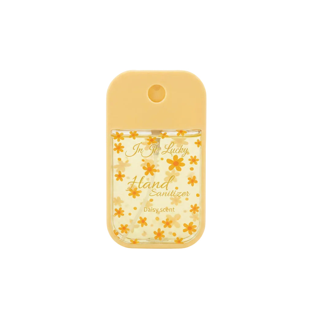 Ju Ju Lucky pocket hand sanitizer spray 45ml in hot pink silicone case with clear lower section decorated with white camellia flower print on pink background, label reads Ju Ju Lucky Hand Sanitizer Camellia 45ml/1.52fl.oz, white background