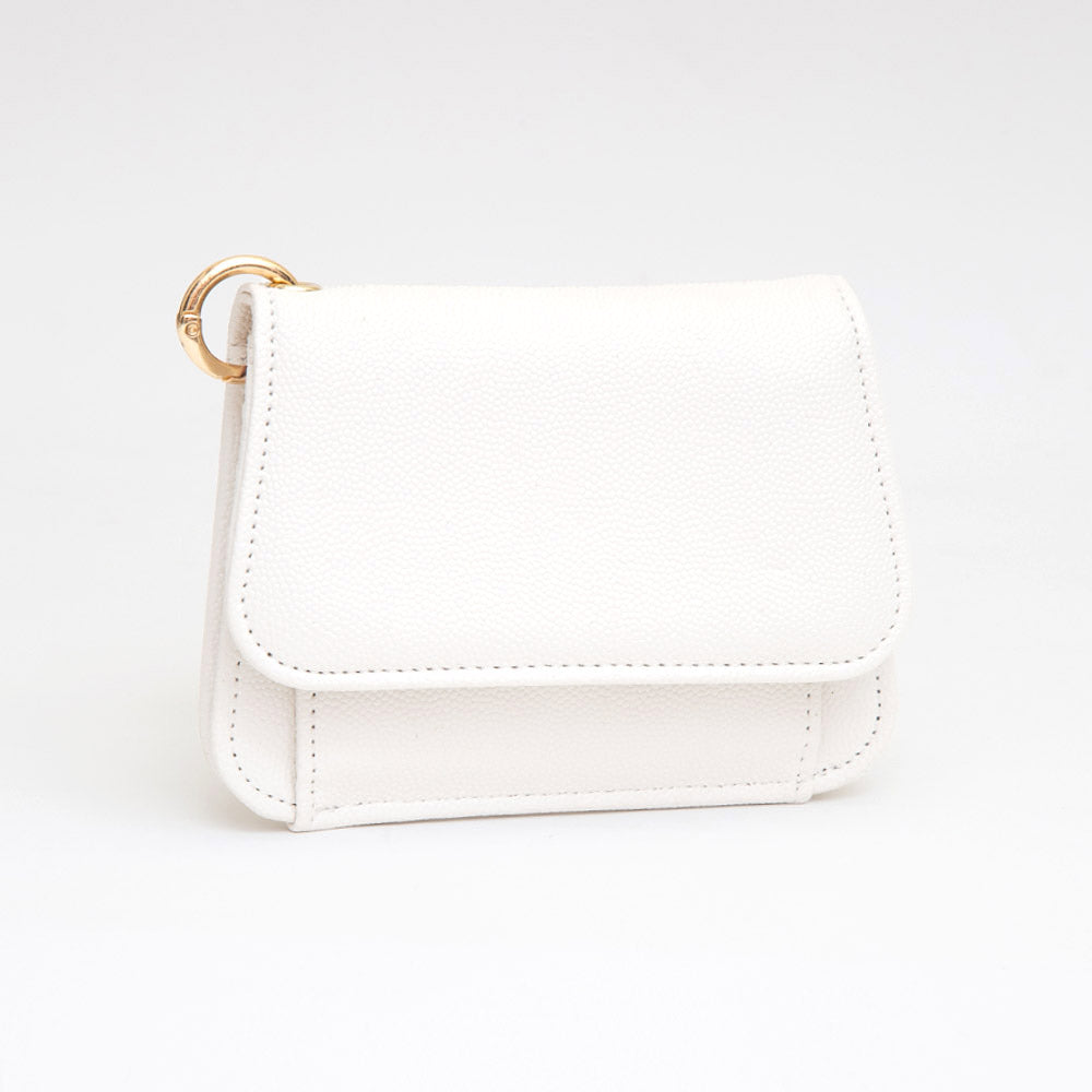 Women's white smooth faux leather compact card wallet with snap flap closure, exterior coin pocket, and gold ring hardware — angled view on white background