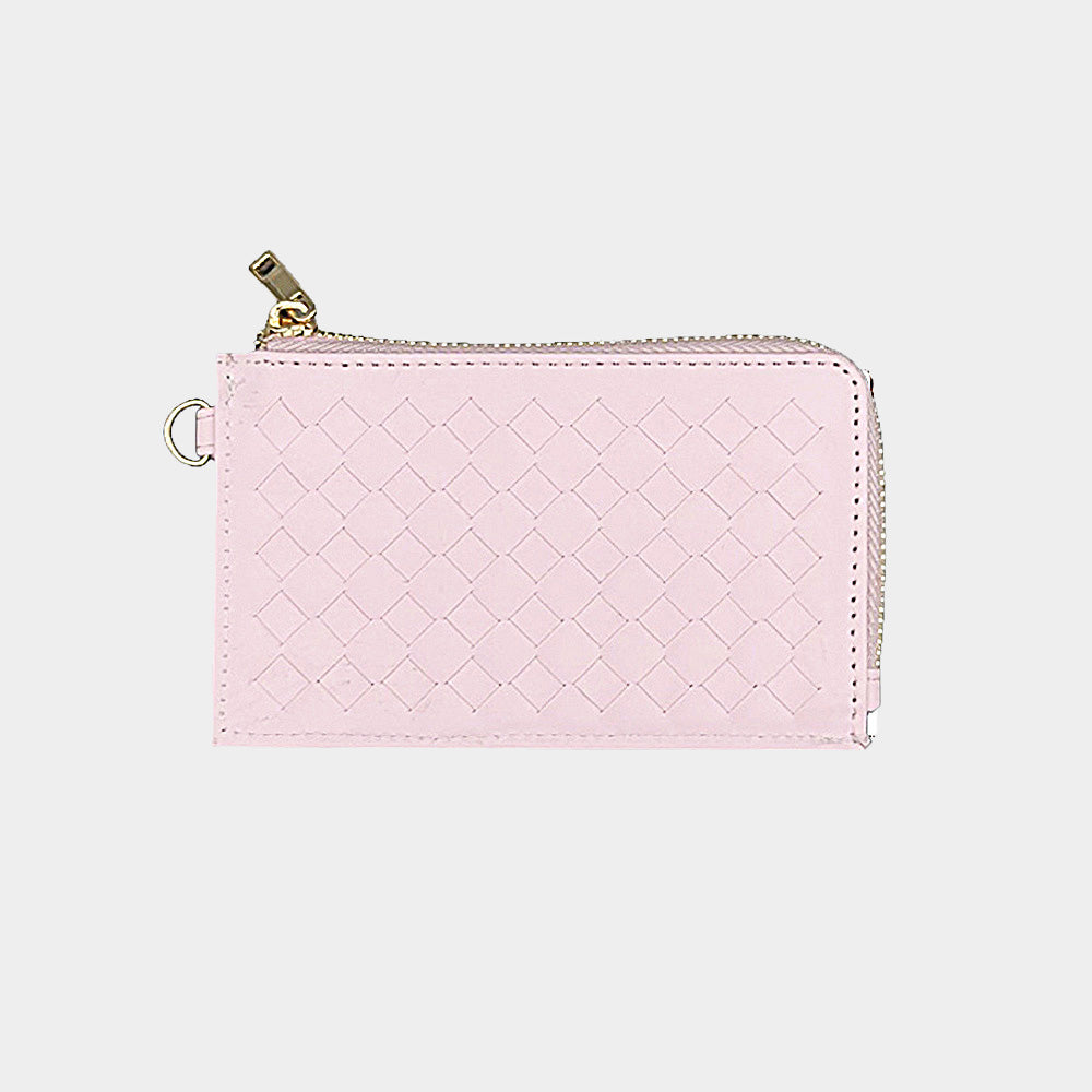 A light pink woven leather zip-around wallet with gold-tone hardware, shown on a plain light gray background.