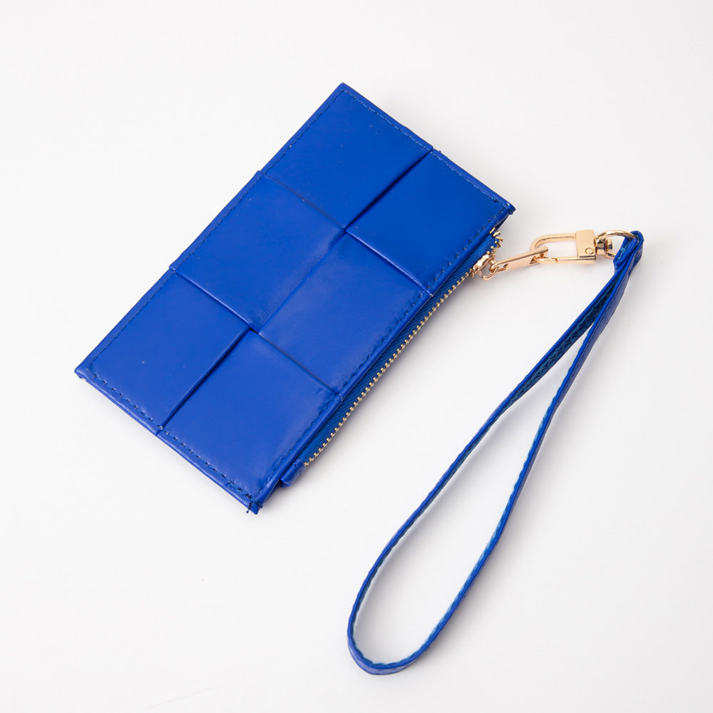 Blue wristlet with a gold chain on a white background
