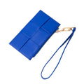 Blue clutch with a strap on a white background