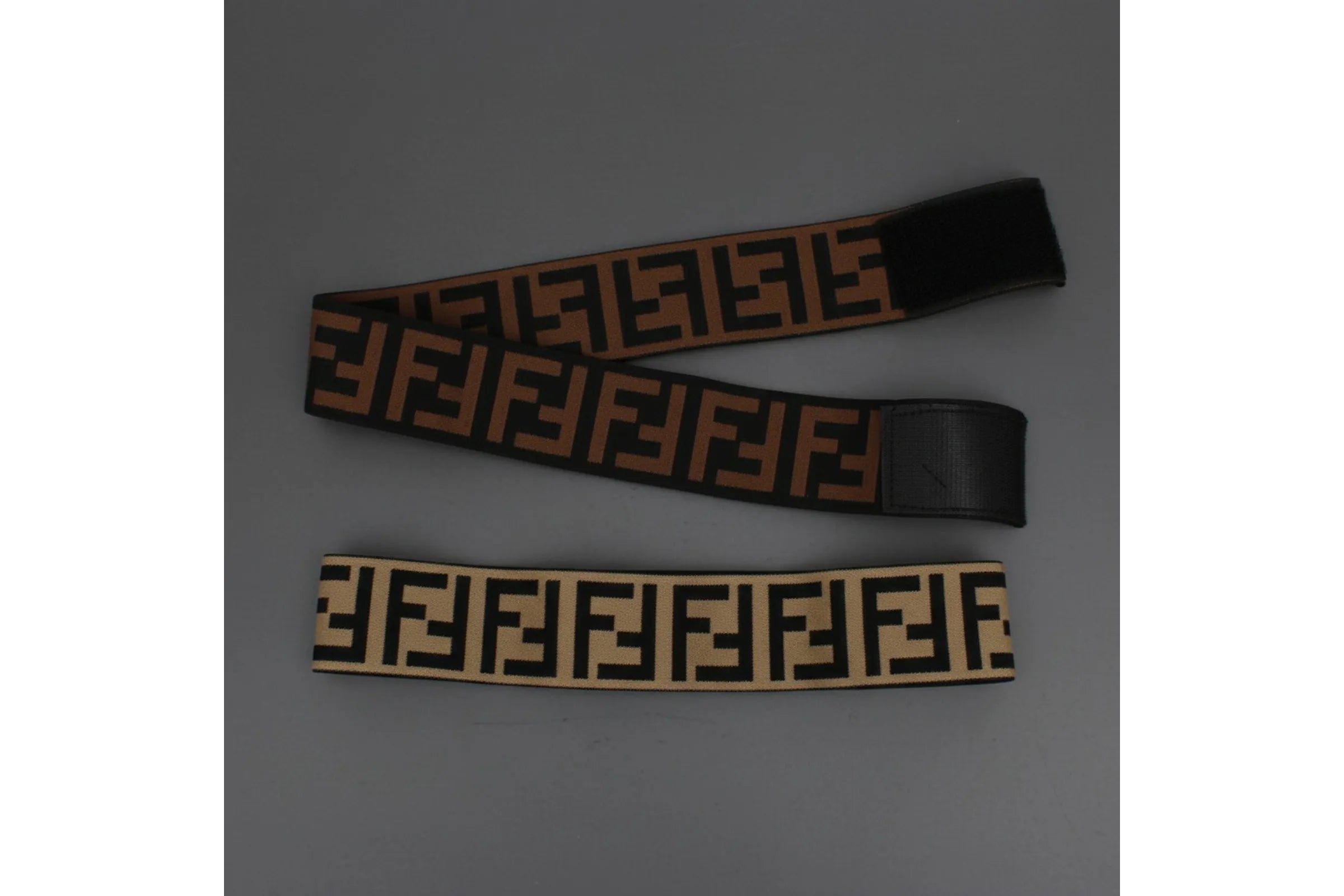 Black and brown wide elastic headbands with geometric interlocking print and adjustable velcro closure