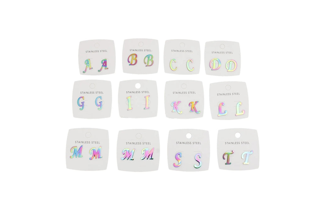 Twelve small white square cards arranged in a grid on a white background, each showing a colorful iridescent letter from A to Z with the text 'STAINLESS STEEL' underneath.