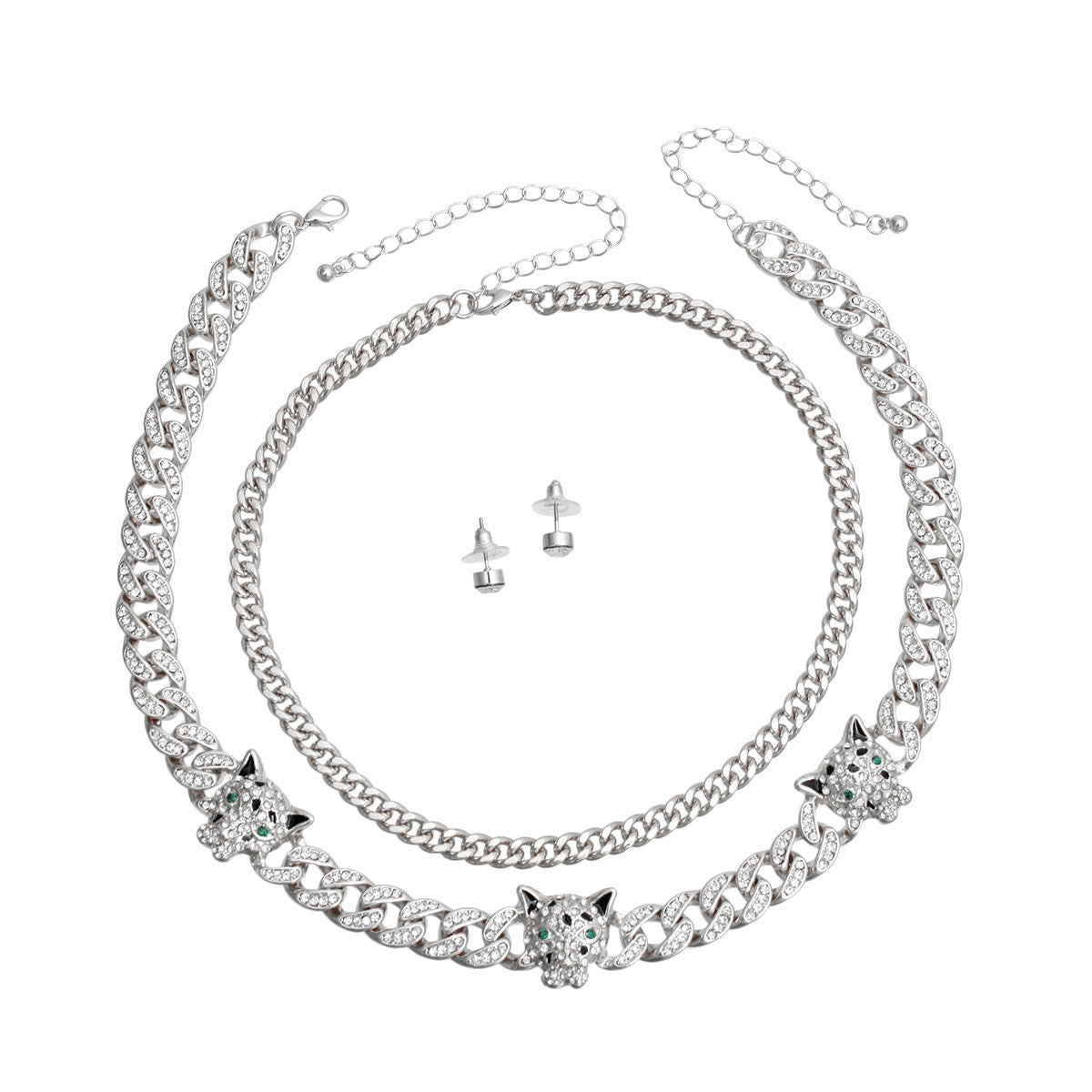 Two-piece silver rhinestone iced Cuban chain necklace set with three leopard head station charms and small round stud earrings, flat lay on white background