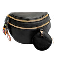 Angled front view of a black pebbled vegan leather sling belt bag with two gold zippers, rainbow woven LOVE pull tabs on the left, and a round black zip coin purse clipped to the right side