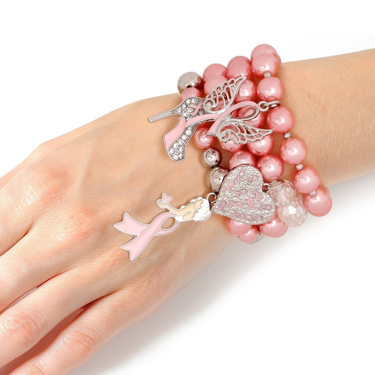  Light pink pearl charm bracelet set stacked on a woman's wrist, showing angel wings, rhinestone high heel, ribbon heart and pink ribbon charms