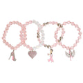 Set of three pink beaded bracelets with various charms on a white background