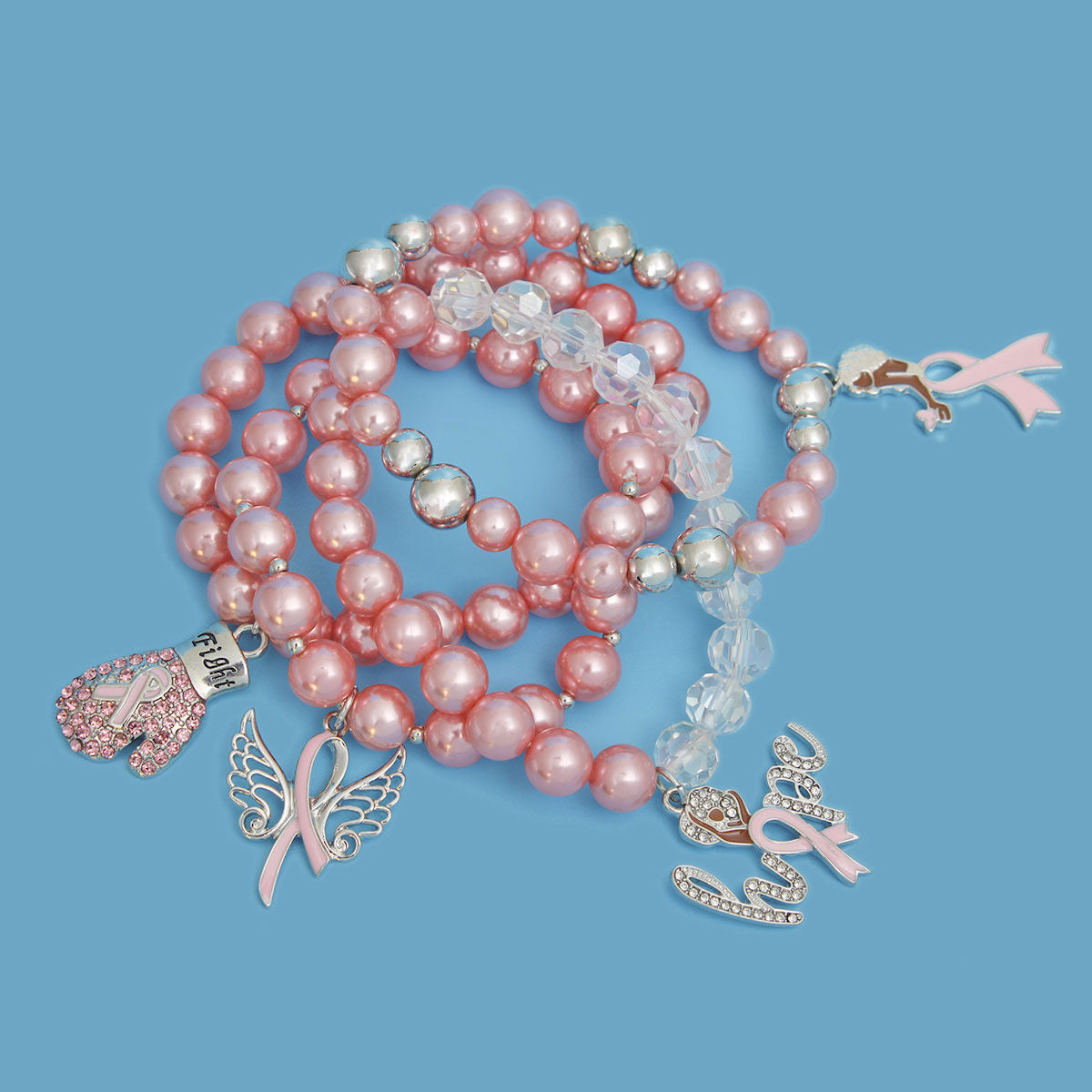 Pink beaded necklace with charms on a blue background