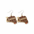 Pair of brown epoxy raised fist fish hook dangle earrings on white background, featuring gold-tone "Queen" script with crown accent, red nail detail, and silver fish hook wires