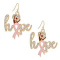 Pair of gold script hope earrings paved with clear rhinestones, featuring a Black woman silhouette with Afro puff and light pink awareness ribbon on white background