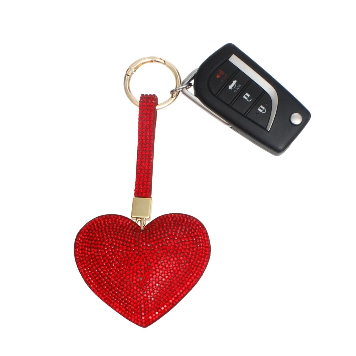 Fully rhinestone-covered red padded heart bag charm keychain with red rhinestone looped strap, gold connector, and gold ring clip, shown attached to a car key fob on white background
