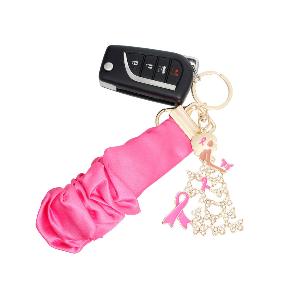 Pink ribbon butterfly lady wristlet keychain holding a car key fob, with gold key ring and swivel lobster clip