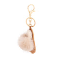 Light brown vegan suede mini mule slide bag charm keychain with cream faux fur pom-pom, gold split keyring, and gold lobster clasp