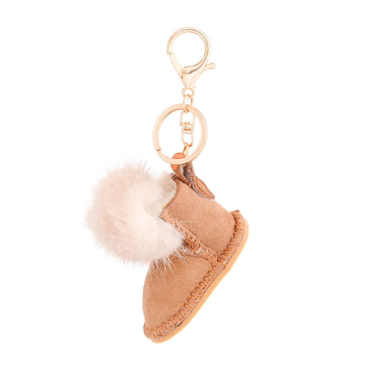 Light brown vegan suede mini boot bag charm keychain with white faux fur pom-pom cuff, stitched sole detail, gold keyring, and lobster clasp