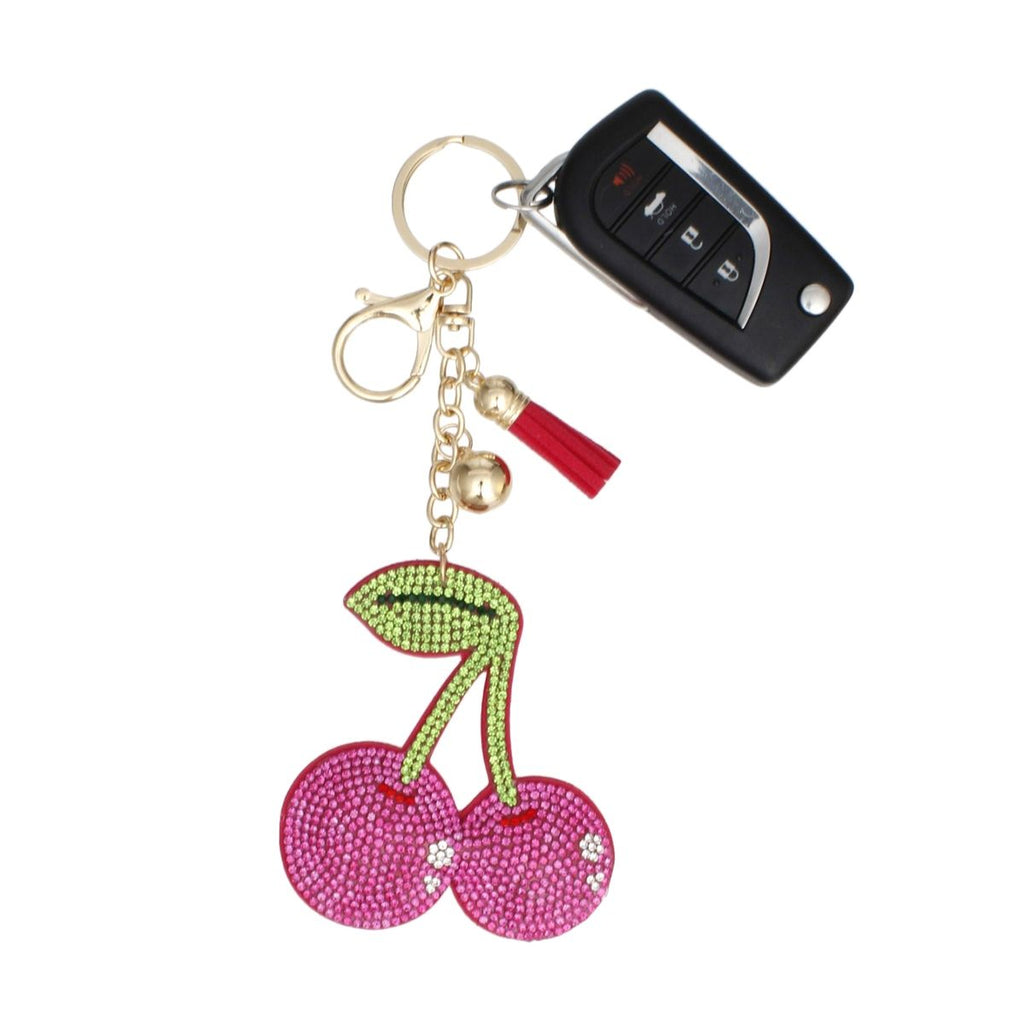 Fuchsia rhinestone double cherry bag charm keychain with green rhinestone stem and leaf, matching mini tassel, gold chain, and lobster clasp