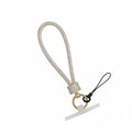 Aurore borealis iridescent rhinestone-encrusted rope phone wrist strap on white background showing 10-inch loop, clear rhinestone square barrel wrap, round gold carabiner clasp, black cord loop, and white plastic card insert
