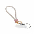 Pink and aurora borealis iridescent rhinestone-encrusted rope phone wrist strap on white background showing 10-inch loop, pink rhinestone barrel wrap, round gold carabiner clasp, black cord loop, and white plastic card insert
