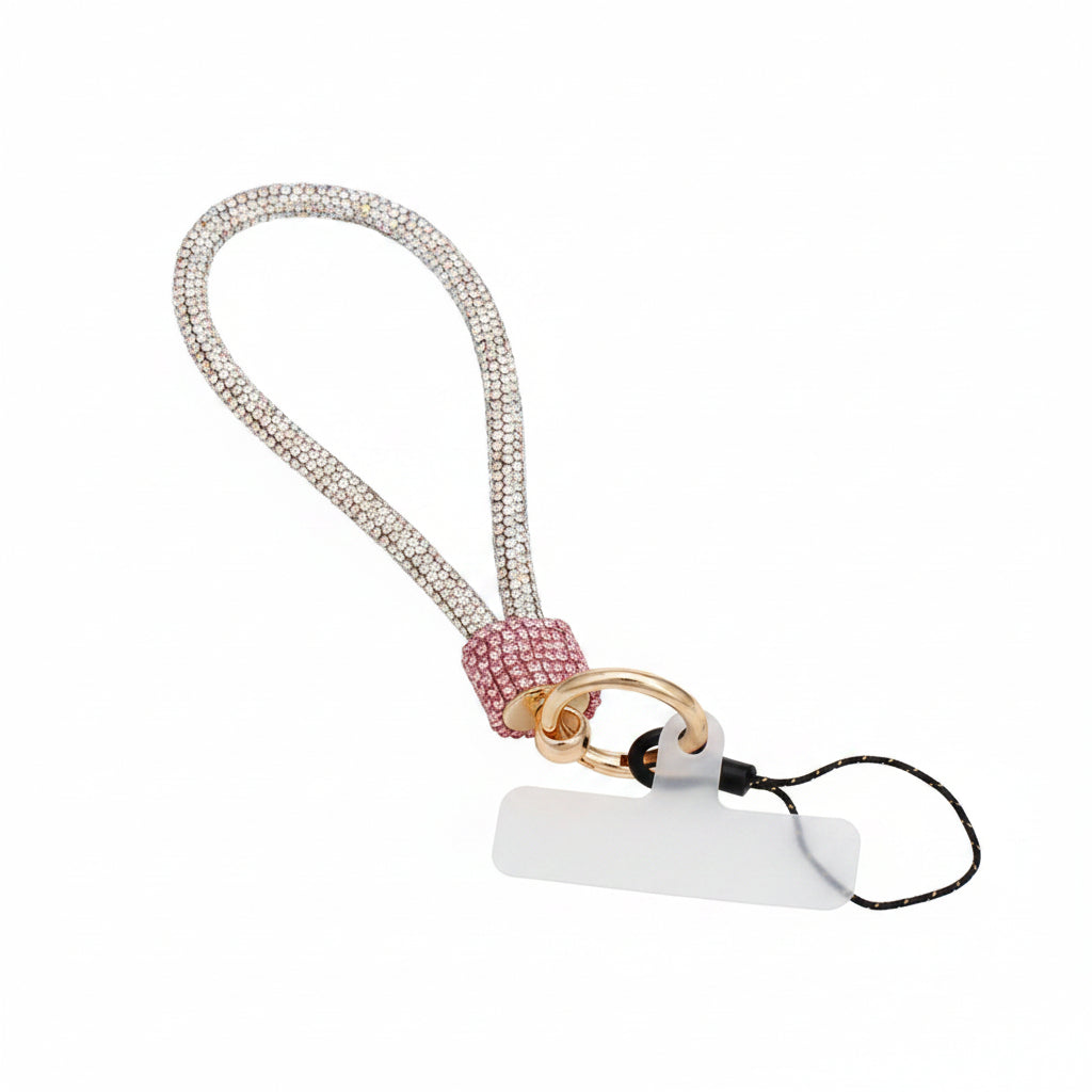 Pink and aurora borealis iridescent rhinestone-encrusted rope phone wrist strap on white background showing 10-inch loop, pink rhinestone barrel wrap, round gold carabiner clasp, black cord loop, and white plastic card insert
