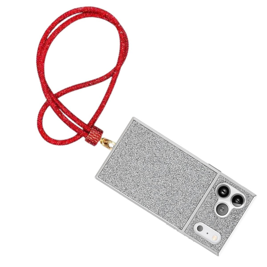 Red rhinestone rope phone lanyard attached diagonally to full-coverage silver rhinestone iPhone case with gold push clasp, displayed on white background