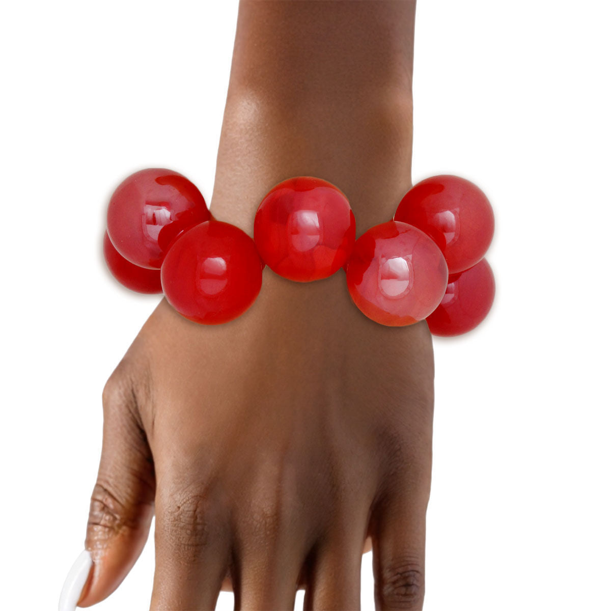 Red bubble bead bracelet worn on a wrist with the hand pointing downward against a white background