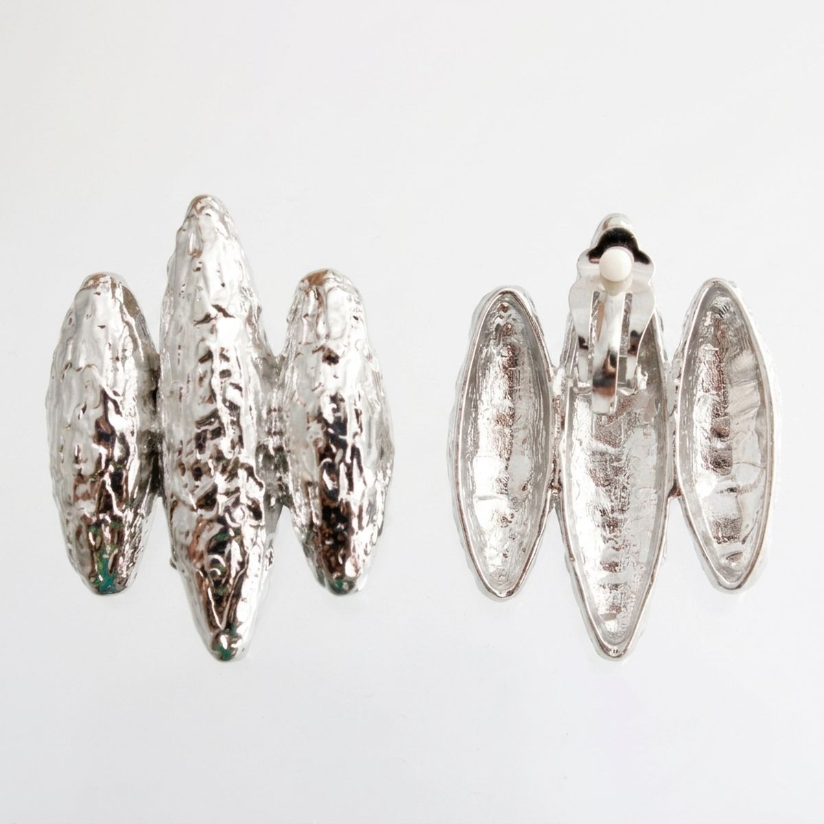 Front and back views of silver textured triple-rib clip-on earrings with paddle-back clip closures on a white background.