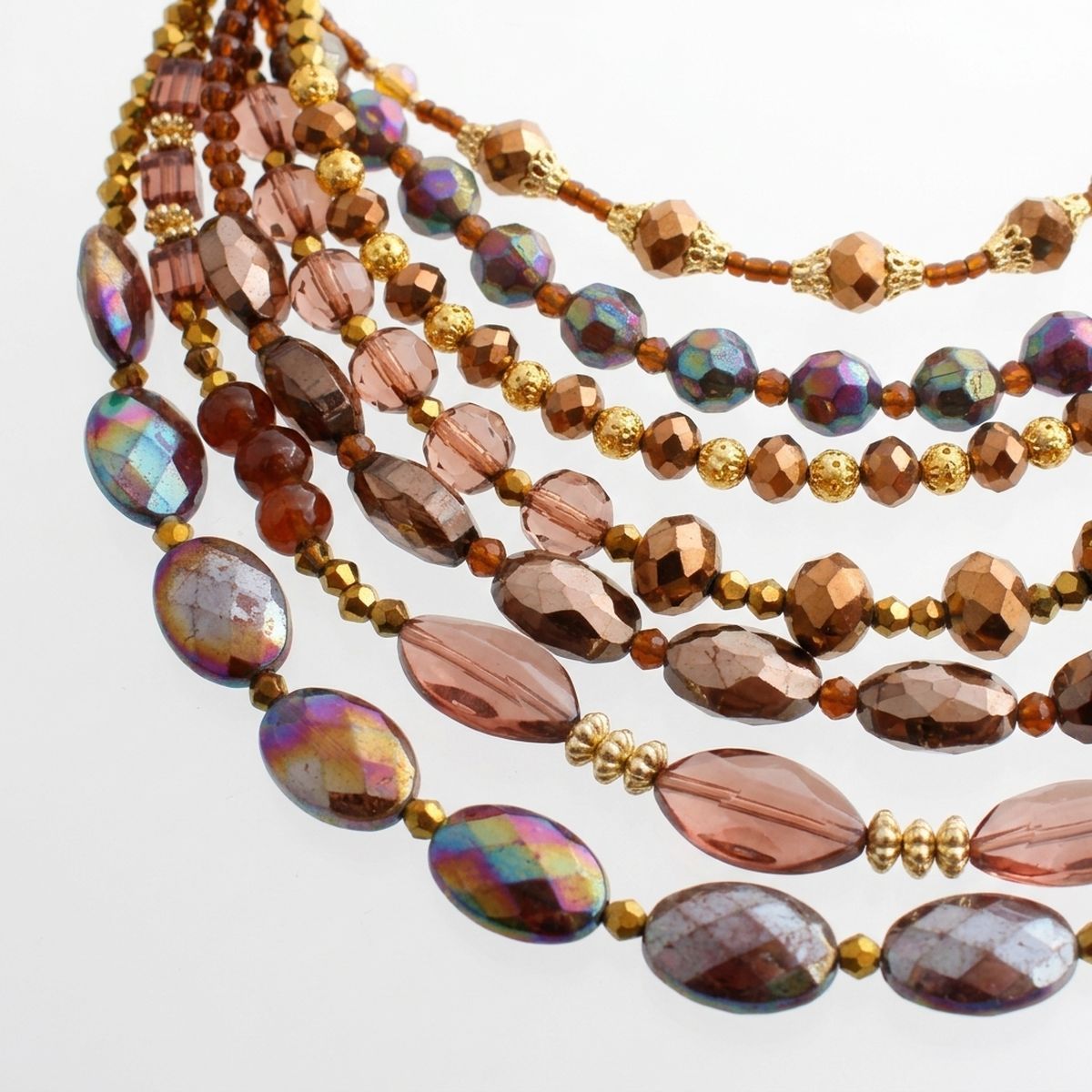 A multi-strand beaded necklace featuring faceted brown beads, iridescent smoky beads, and metallic gold spacer beads, displayed on a clean white background.