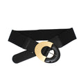 Black wide stretch belt crossed and laid flat on white background, smooth black vegan faux leather front panel, oversized round two-tone buckle with gold metal upper half and black glossy acrylic lower half with silver pin closure, black elastic stretch canvas back