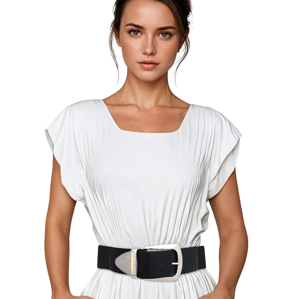 Black wide stretch belt with large silver metal buckle worn on woman's waist over white pleated short-sleeve dress, oversized silver rectangular buckle with curved pin closure, black elastic stretch back panel, white background