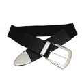 Black wide stretch belt crossed and laid flat on white background, black ribbed texture faux leather front panel with silver oval tip hardware, large silver pin buckle with curved rectangular frame, black elastic stretch canvas back