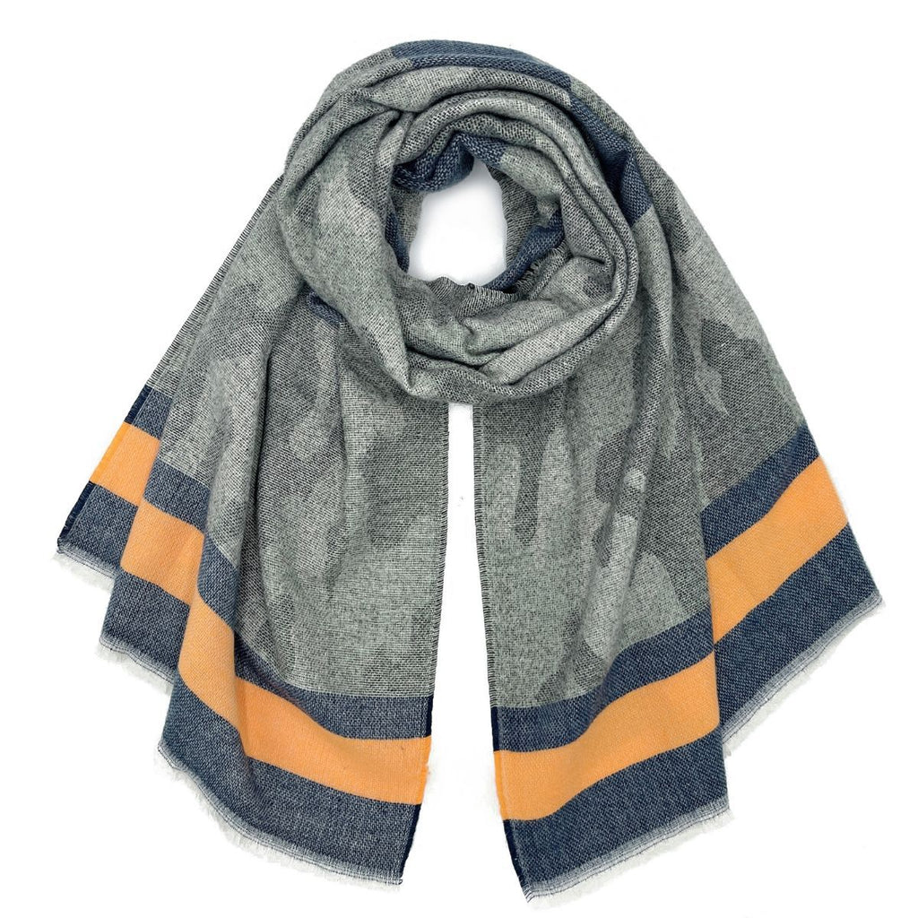 Gray camouflage scarf loosely looped on a white background, showing dark blue and orange striped borders and short pale frayed edge