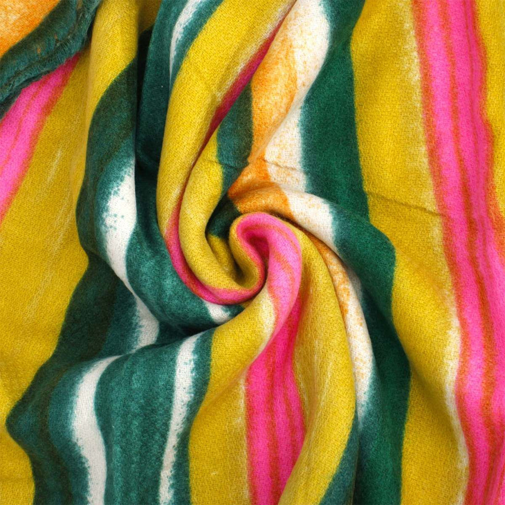 Close-up of softly textured scarf fabric arranged in a swirl, showing green, yellow, pink, orange, and cream stripes