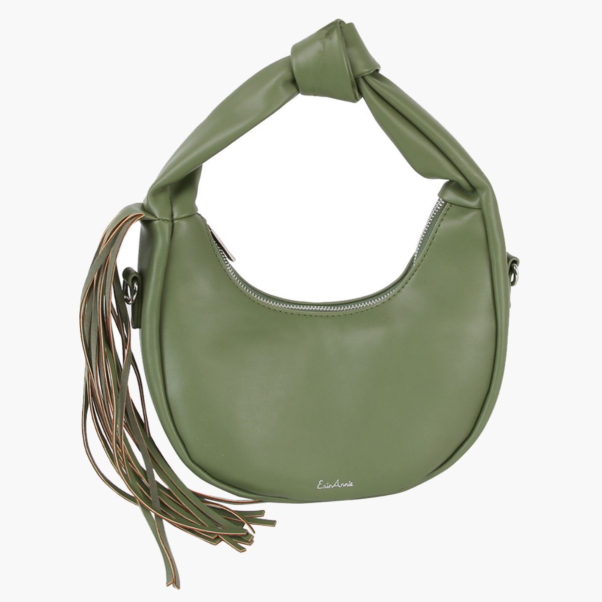 Front view of a sage green crescent handbag with a knotted handle, long fringe on the left, silver-tone zipper, and small metallic logo against a white background