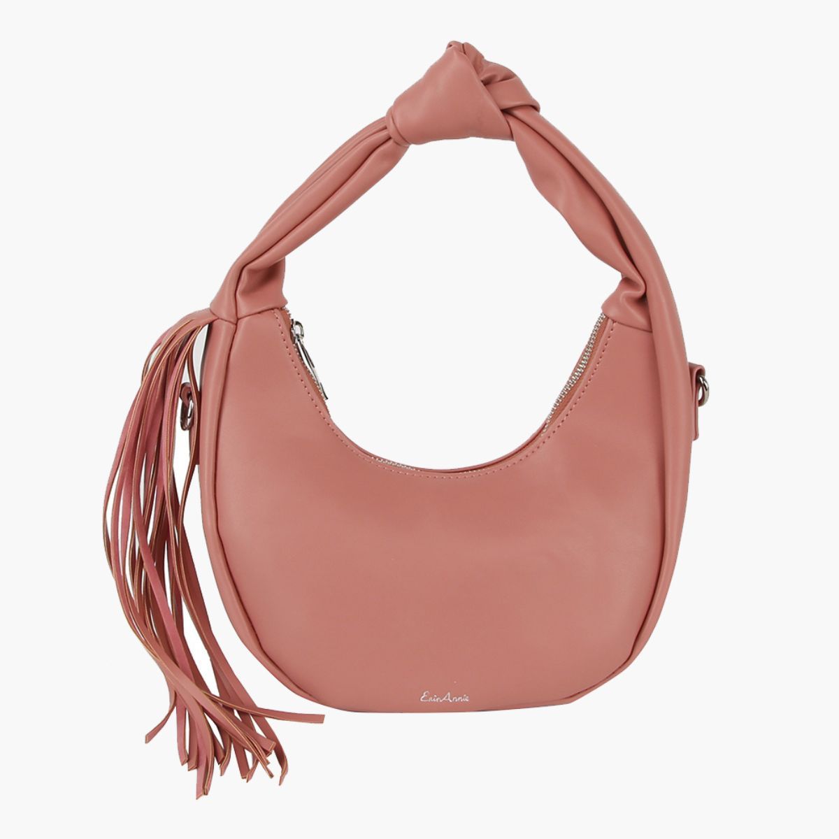 Blush pink crescent handbag with a knotted handle, long side tassel, and silver-tone zipper on a white background