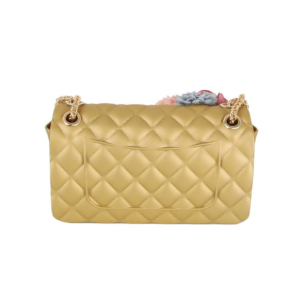 Back view of the gold quilted jelly bag showing plain diamond quilting and a flat slip pocket, with the flowers just visible over the top edge