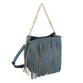 Angled view of a denim-blue faux leather fringe bag with a gold-tone chain handle and matching long strap against a white background