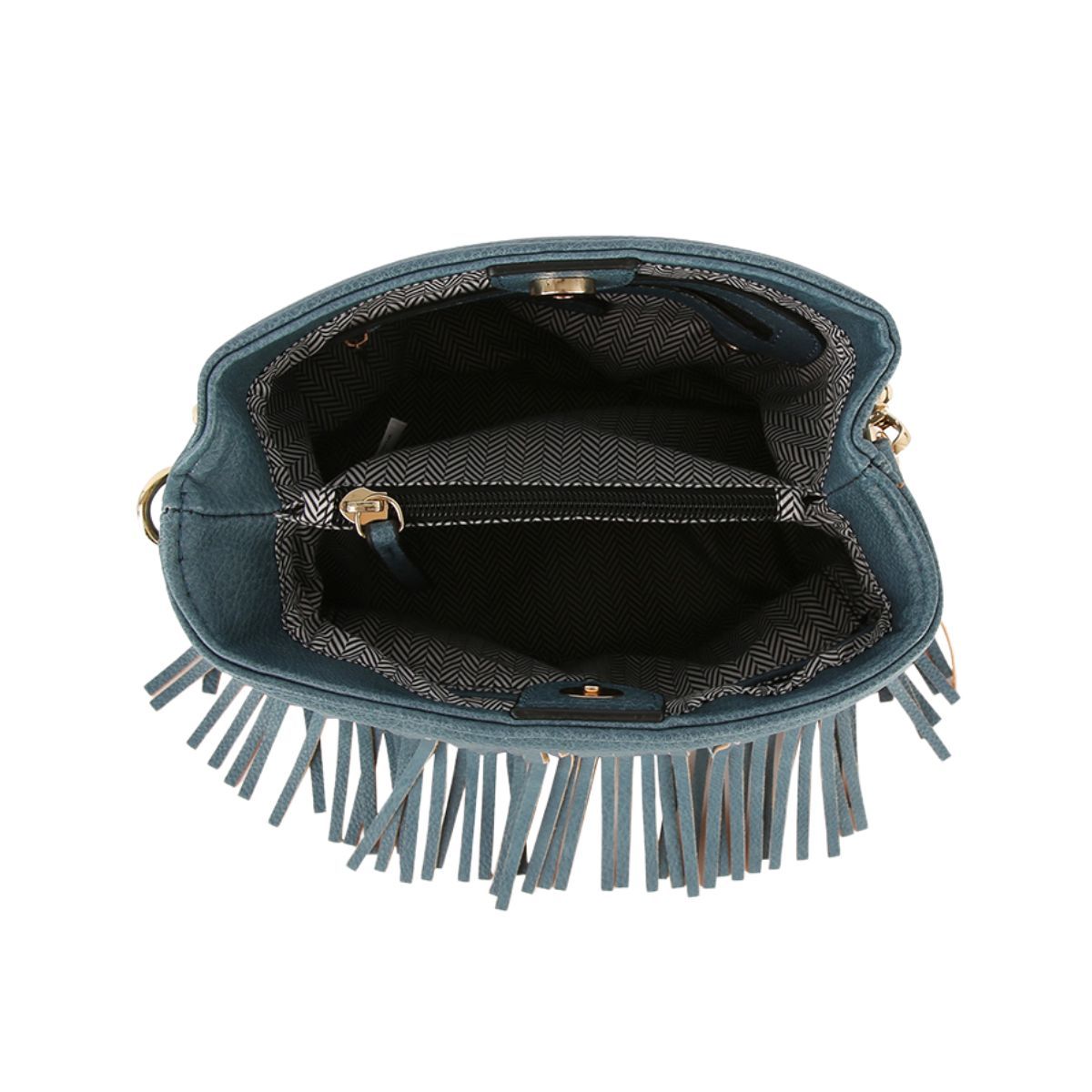 Open denim-blue fringe handbag showing herringbone-patterned lining, a zippered center compartment, and magnetic snap closure